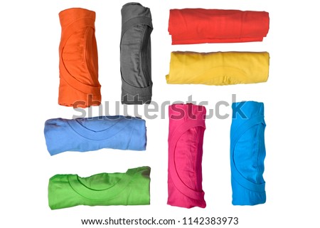 Set of colorful rolled clothes isolated over white background Royalty-Free Stock Photo #1142383973