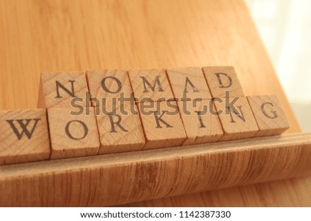 TOKYO, JAPAN. 2018 July 20th. Wooden Block Text of Nomad Working
