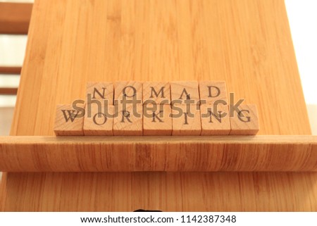 TOKYO, JAPAN. 2018 July 20th. Wooden Block Text of Nomad Working