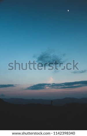 Pictures of the Blue Ridge Mountains at sunset. Blue and pink skies with clouds in the sky.