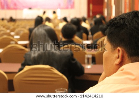 Young man sitting in the conference room to listen to the lecture