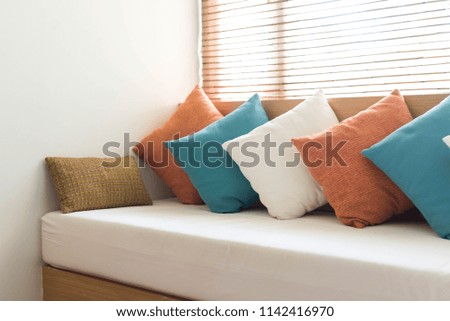 Many pillows on the sofa. Interior