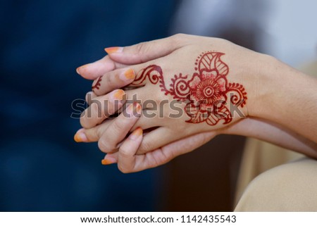 Creative Henna or Inai in Malay. Reddish brown dye derived from tropical plant commonly applied to ladies during wedding celebration.