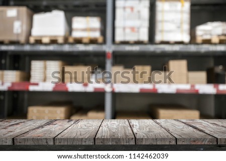 Empty wood Shelf on storage warehouse background