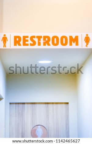 man and woman use toilet after delicious meal in fast food.clean lavatory in restaurant.acrylic toilet restroom sign in coffee shop cafe.male and female washing hands in restroom.toilet symbol.