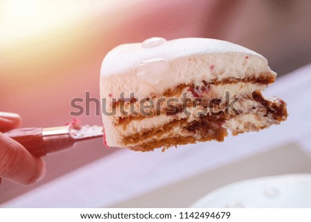 A slice of homemade delicious biscuit with cream and decoration