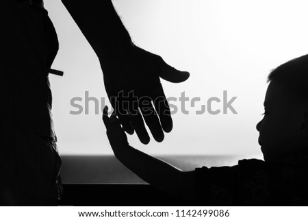 Beautiful arms of the parent and child silhouette of the background