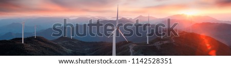 Renewable energy wind turbines on the mountain Royalty-Free Stock Photo #1142528351