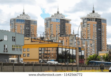 multi-storey residential buildings and a construction crane. new buildings