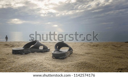 Shoes on the beach in the morning