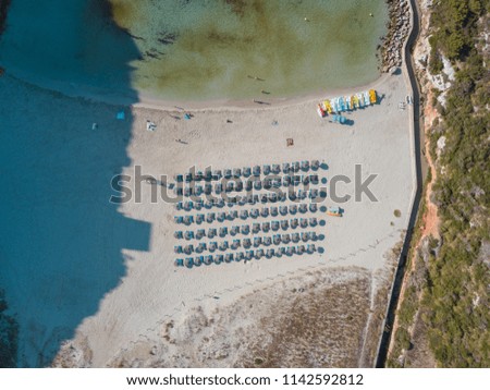 Aerial Drone Above View Beach Umbrella Seats Next To The Sea
