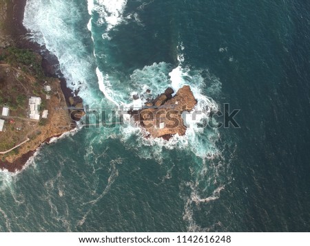 Aerial view of Timang beach. Timang beach is a beach attraction is a region at the boundary between the sea and the land that is located in Gunung Kidul, Yogyakarta, Indonesia.