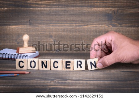 concern. wooden letters on the office desk, informative and communication background