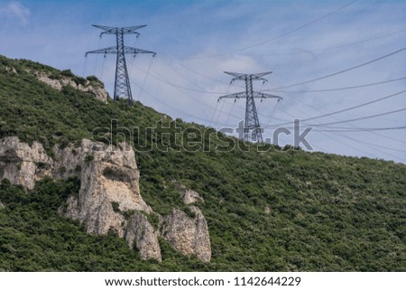 electric poles on a hill