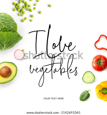 Creative layout made of  quote "I love vegetables". Food concept. Tomato, cucumber, pepper, radish, cabbage and green peas on the white background.