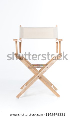 director chair made of wood and fabric well Comfortable sitting on a white backdrop, copy space Royalty-Free Stock Photo #1142695331
