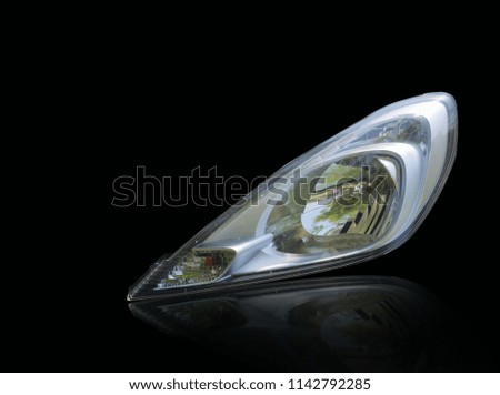 Car headlights that are separate from the background scene, white with split.