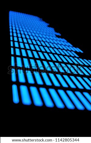 Luminous panel of pixels, with neon blue with green color and an equalizer on a black background