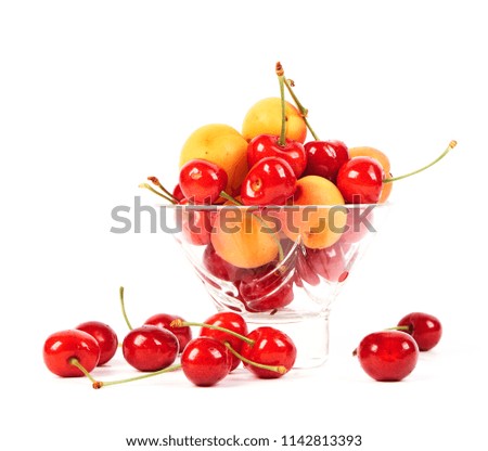 Fresh delicious apricot and cherries isolated on white background