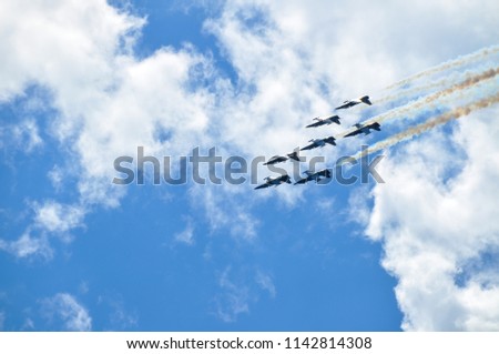 Seven Jets Flying Upside Down at an Air Show