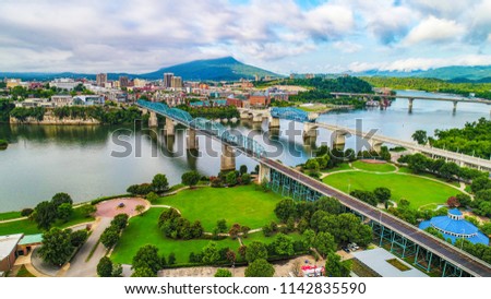 Drone Aerial of Downtown Chattanooga TN Skyline, Coolidge Park and Market Street Bridge. Royalty-Free Stock Photo #1142835590