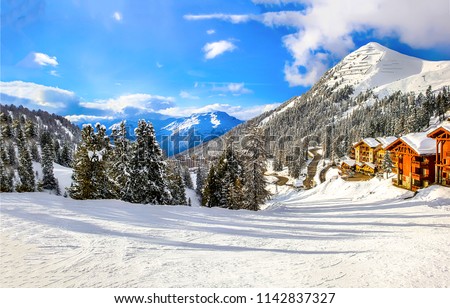 Winter mountain snow ski resort in Alps vacation