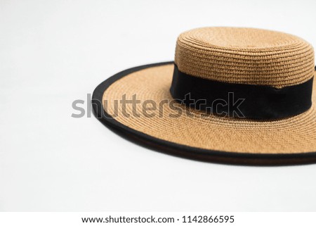 Hat with ribbon and bow on white background
