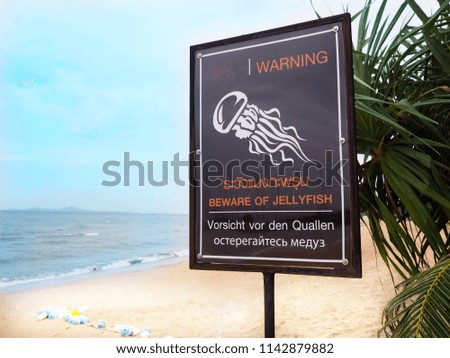 Warning sign on the beach, beware of jellyfish.