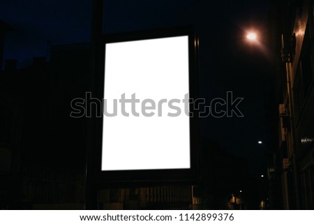 Modern empty billboard with space for text at night