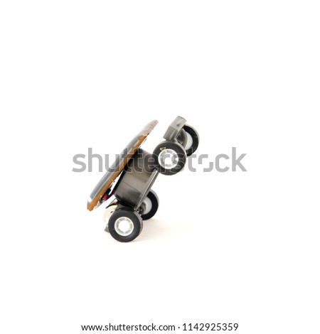 Studio shot educational solar powered toy car isolated on white. Mini solar cells panel at the top roof