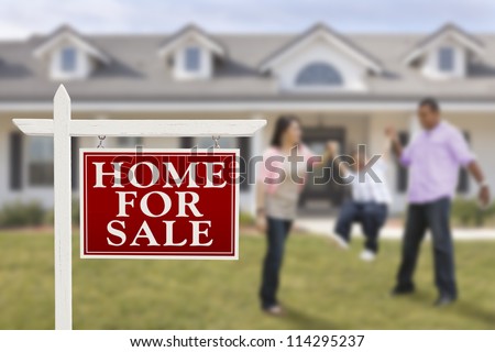 Home For Sale Real Estate Sign and Playful Hispanic Family in Front of House.