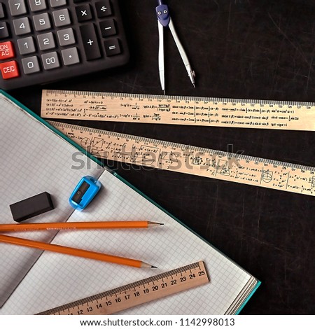 Mathematics education equipment tools.  Formula equation symbol printed on rulers. Study concept. Solve mathematical problem.