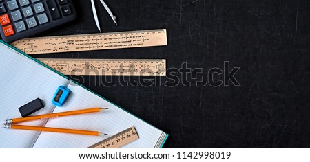 Mathematics education equipment tools.  Formula equation symbol printed on rulers. Study concept. Solve mathematical problem.