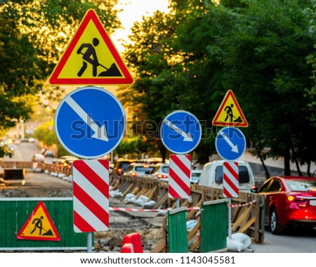 Road repair and car sign directions and repair signs.