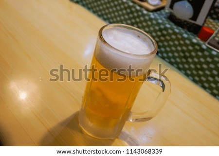 A glass of Japanese beer serve by restaurant 