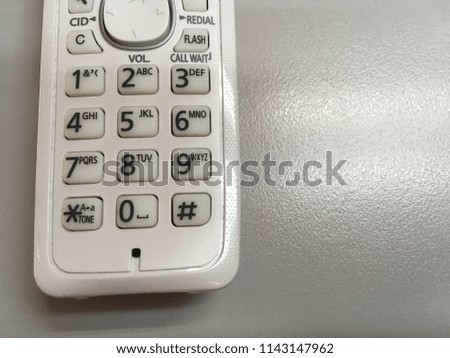 Number pad of telephone. Black number on white buttons.