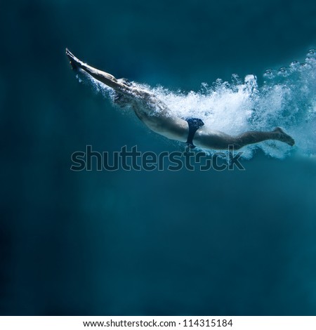 professional swimmer underwater after the jump Royalty-Free Stock Photo #114315184