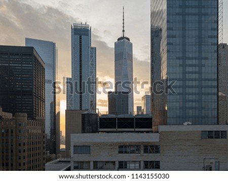 Downtown New York City aerial skyline in the evening towards sunset.