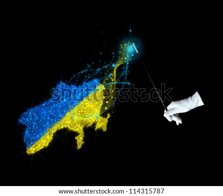 Magic wand and the Ukrainian flag on a black background