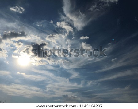 Beautiful clouds against a blue sky background. Cloudscape sky. Blue sky with cloudy weather, nature cloud. White clouds, blue sky and sun.