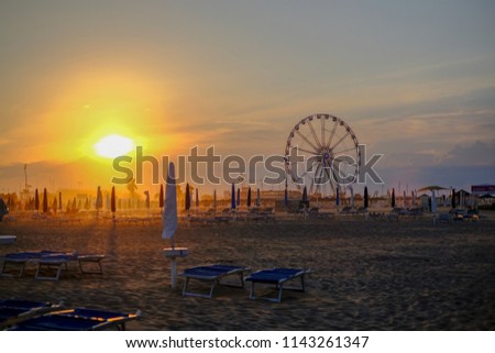 rimini panoramic wheel sunset on beach