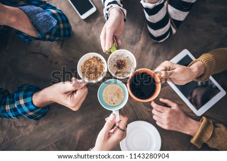 People drinking coffee high angle view Royalty-Free Stock Photo #1143280904