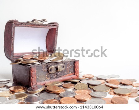 Money coins stack with treasure chest isolated on white background with copy space.