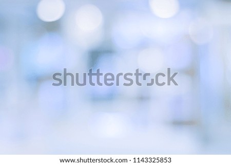 Perspective blur background image of hallway in shopping mall or department store with bokeh and people background usage concept.