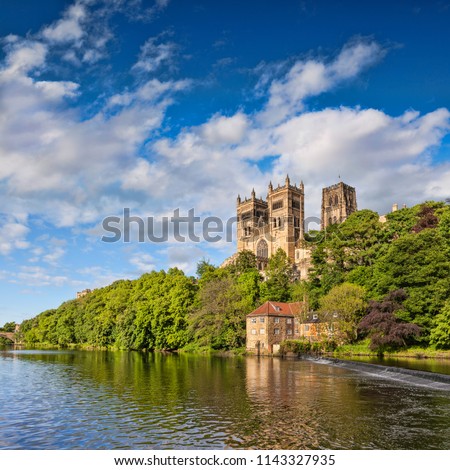 Durham Cathedral, on its rocky outcrop above the River Wear, in County Durham, England.  Royalty-Free Stock Photo #1143327935