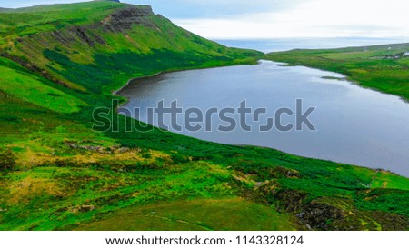 Small and beautiful lake on the top of a hill in the Scottish Highlands