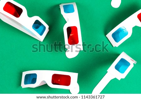 Paper 3d glasses on green background. Cinema concept. Watch film