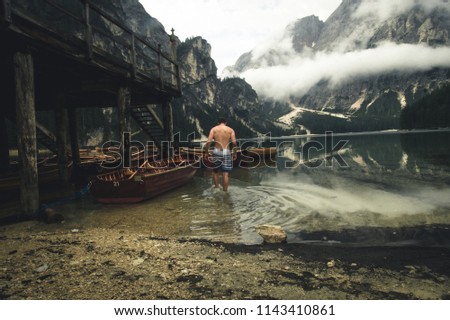 
A lonely man at lake Lago di Brais, Italy