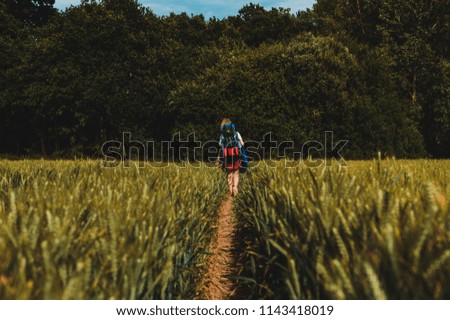 Picture of a girl hiking with camping gear