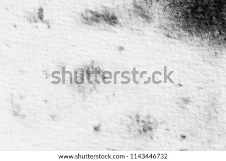 Black ink on the paper abstract watercolour texture background